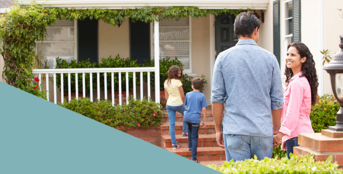 family walking into a new home